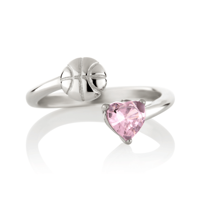 Silver Follow Through basketball ring with pink heart-shaped gemstone and basketball detail on a white background