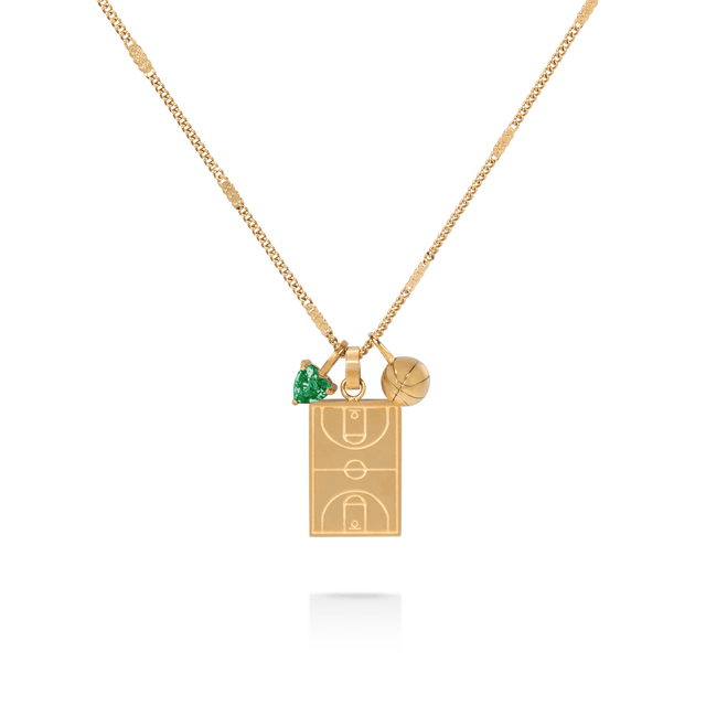 Gold basketball court pendant necklace with basketball charm and green heart gem